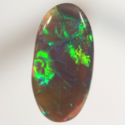 SOLID BLACK CRYSTAL OPAL Rolling flashes of golden green